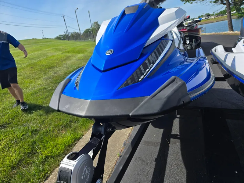 Slide: The Image of 2017 Yamaha WaveRunner VX Limited in blue on a trailer near a grassy area. - 6
