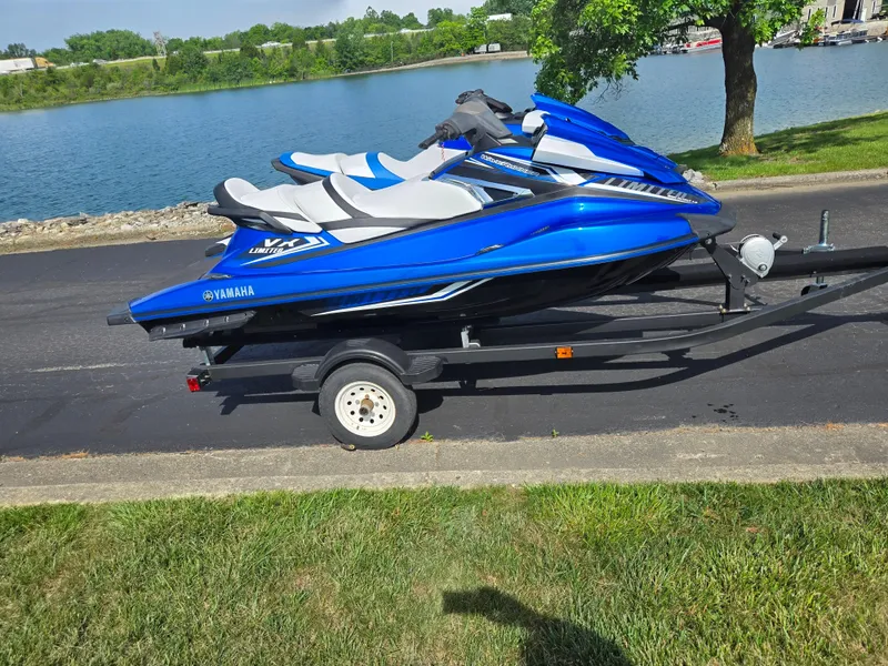 Slide: The Image of 2017 Yamaha WaveRunner VX Limited on trailer by a lakeside road. - 9