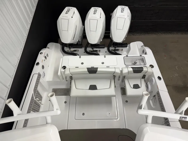Slide: The Image of 2025 Wellcraft 352 Fisherman boat with triple Mercury outboard engines, viewed from above. - 11