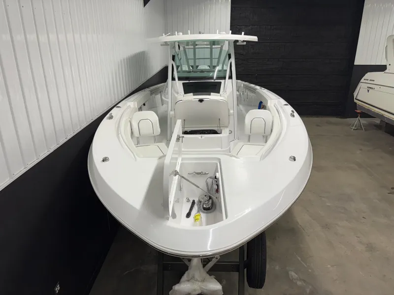 Slide: The Image of 2025 Wellcraft 352 Fisherman boat in indoor storage, showcasing sleek design and spacious deck. - 4
