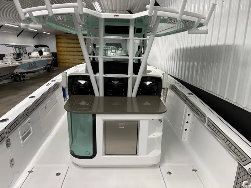 Slide: The Image of 2025 Wellcraft 352 Fisherman boat interior with modern helm and storage features. - 7