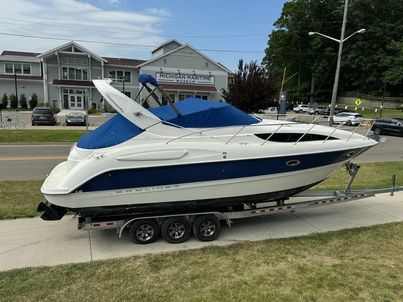 Slide: The Image of 2005 Bayliner 305 boat on trailer outside Michigan Maritime Museum. - 0