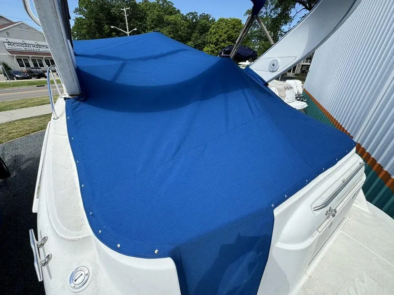 Slide: The Image of 2005 Bayliner 305 boat with blue cover at Michigan Maritime Museum. - 3