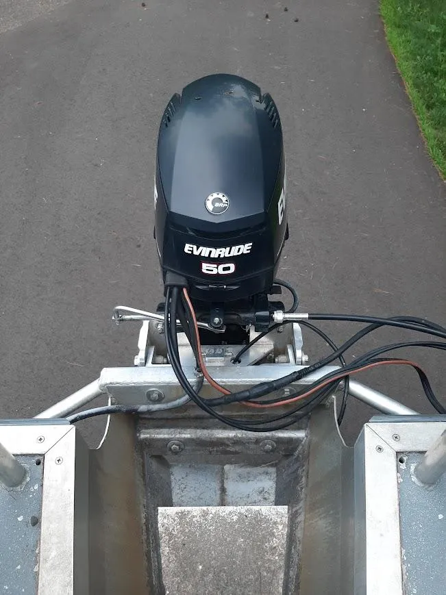 Slide: The Image of Evinrude 50 outboard motor on Custom River Time Houseboat, 2010 model. - 5