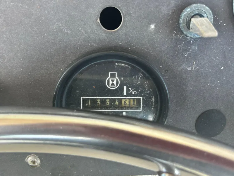 Slide: The Image of Hour meter on 1974 Viking Boats 40 Sport Fish dashboard, showing 1334.6 hours. - 20