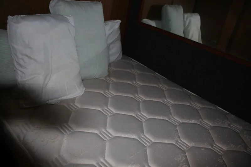 Slide: The Image of Bed with pillows in a 1974 Viking Boats 40 Sport Fish cabin. - 6