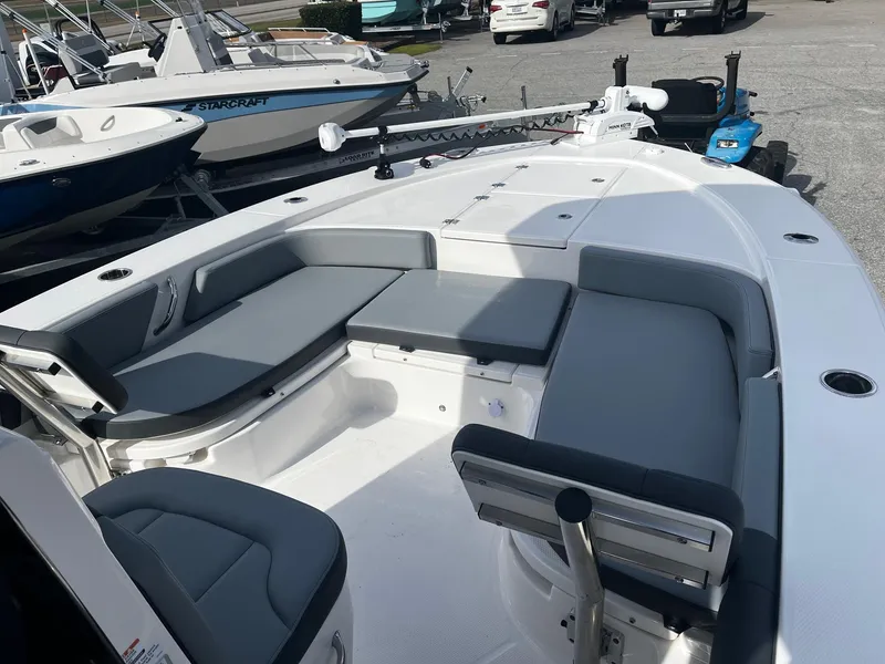 Slide: The Image of 2025 Robalo 246 Cayman boat interior with gray seating and modern design. - 14