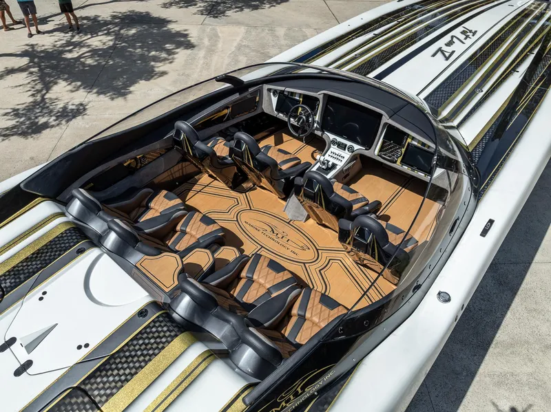 Slide: The Image of Luxurious 2017 MTI 48 speedboat interior with sleek design and advanced controls. - 46