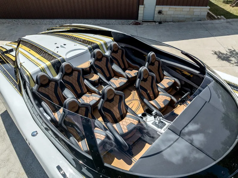 Slide: The Image of Luxury MTI 48 speedboat interior with custom seating, 2017 model, featuring sleek design and premium materials. - 47