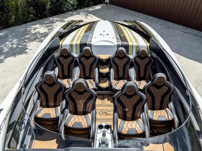 Slide: The Image of Luxurious 2017 MTI 48 boat interior with eight custom leather seats and sleek design. - 49
