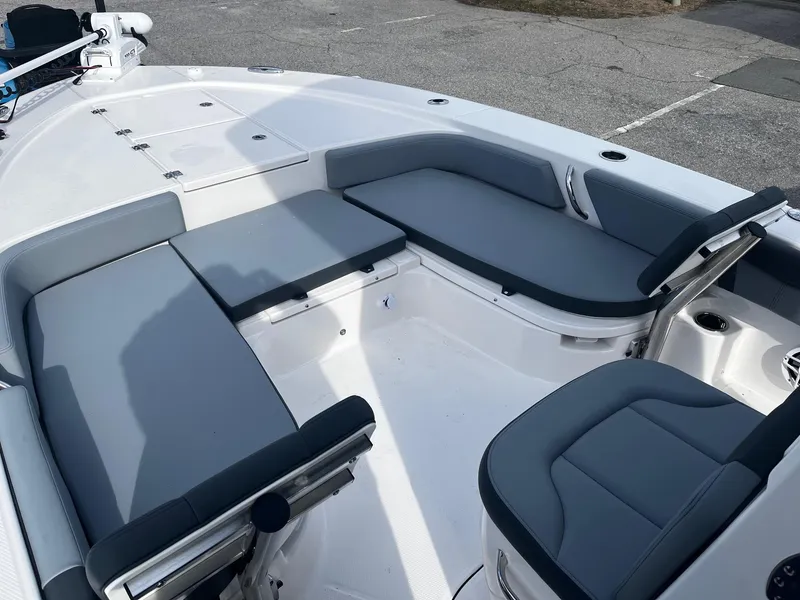 Slide: The Image of 2025 Robalo 246 Cayman boat interior with gray seating and spacious deck layout. - 16