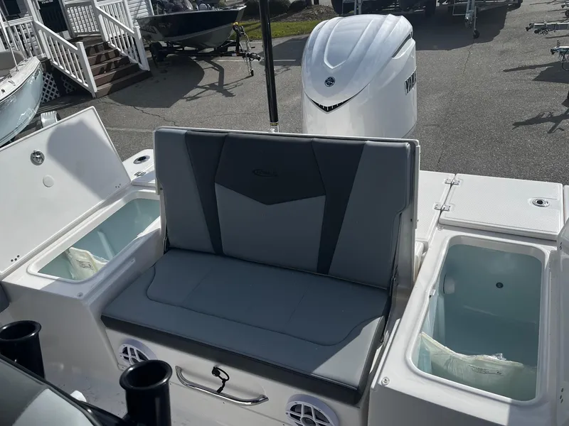 Slide: The Image of 2025 Robalo 246 Cayman boat interior with seating and storage compartments. - 10