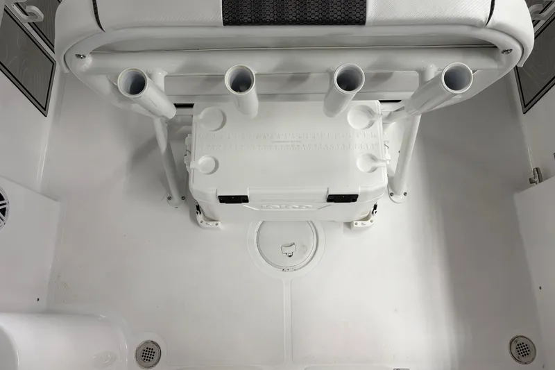 Slide: The Image of 2025 Wellcraft 223 Fisherman boat interior with rod holders and storage compartment. - 11