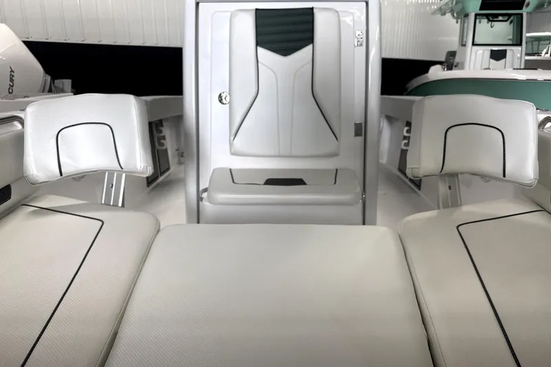 Slide: The Image of 2025 Wellcraft 223 Fisherman boat interior with white seating and modern design. - 5