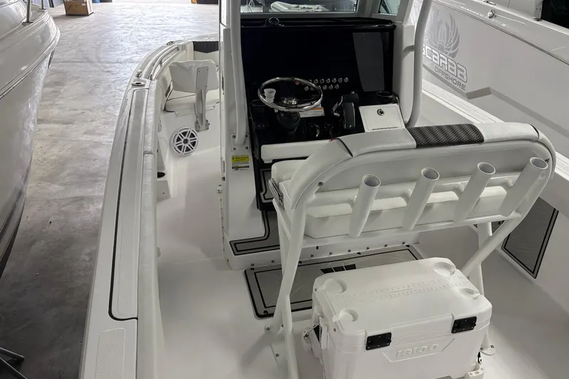 Slide: The Image of 2025 Wellcraft 223 Fisherman boat interior with helm and seating area. - 6