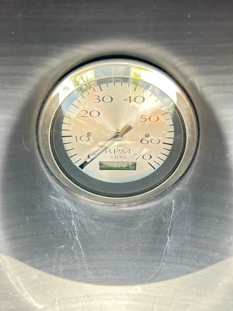 Slide: The Image of Close-up of RPM gauge on 2021 Bennington L 24 Swingback boat dashboard. - 13