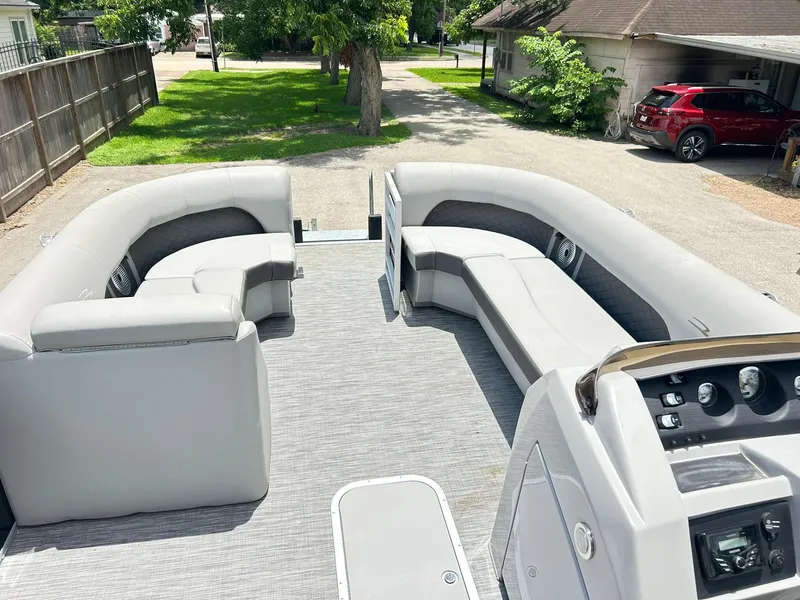 Slide: The Image of 2021 Bennington L 24 Swingback pontoon boat with spacious seating and modern dashboard. - 16