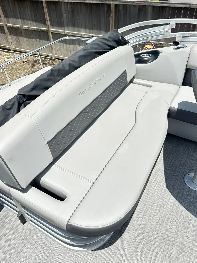 Slide: The Image of 2021 Bennington L 24 Swingback boat seat with gray upholstery and diamond pattern. - 21