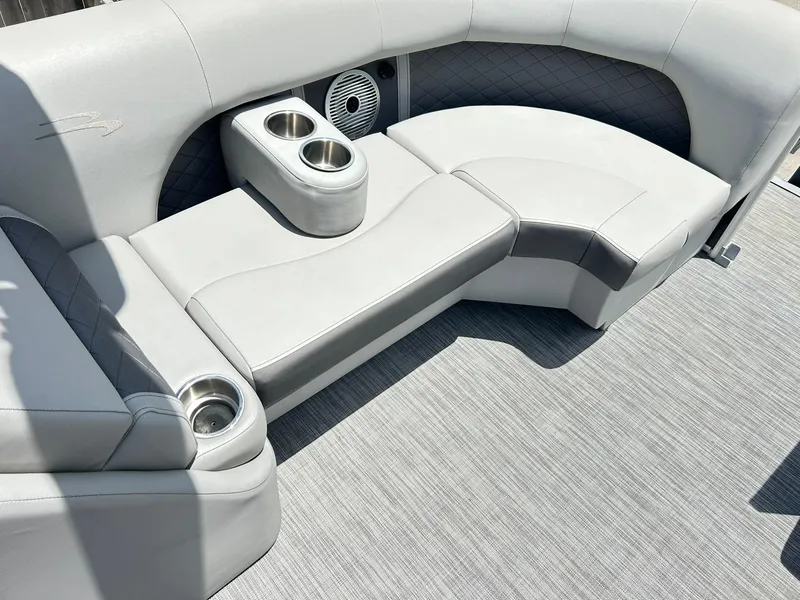 Slide: The Image of Luxurious seating on 2021 Bennington L 24 Swingback pontoon boat with cup holders. - 26