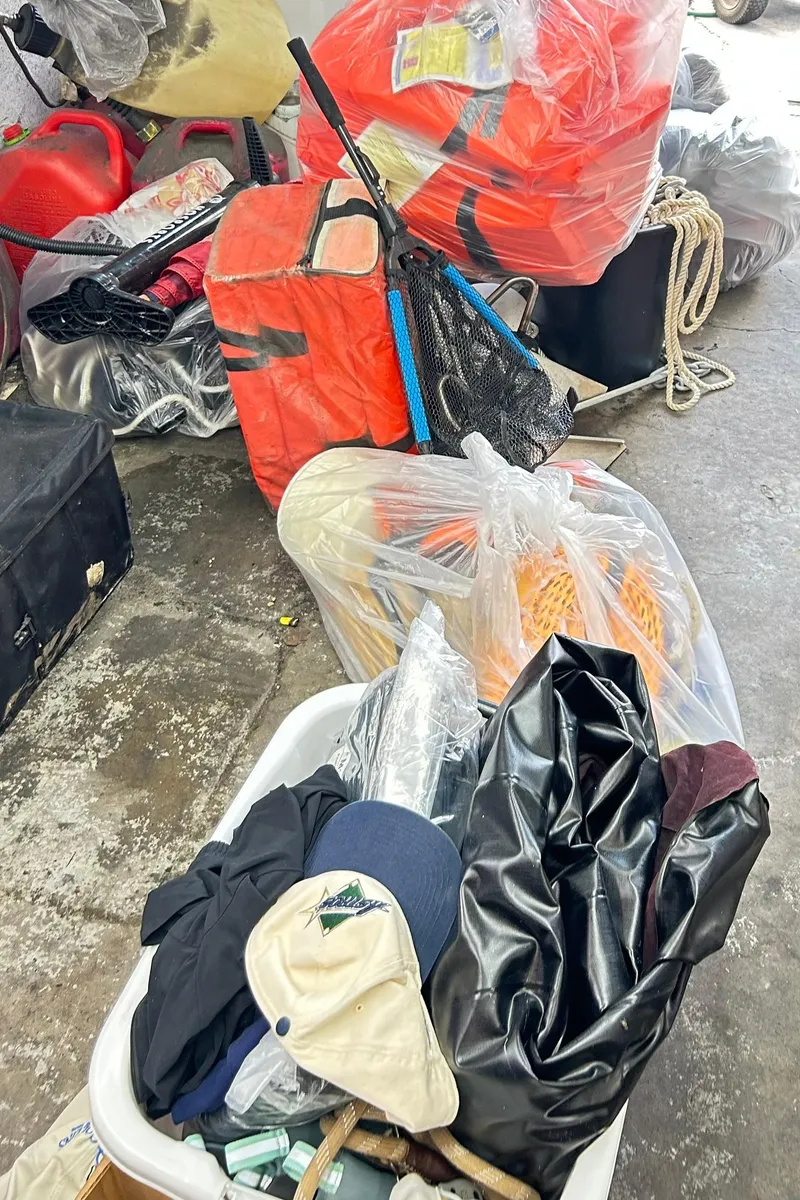 Slide: The Image of Assorted boating gear and supplies, including life jackets and ropes, for a 2021 Bennington L 24 Swingback. - 44