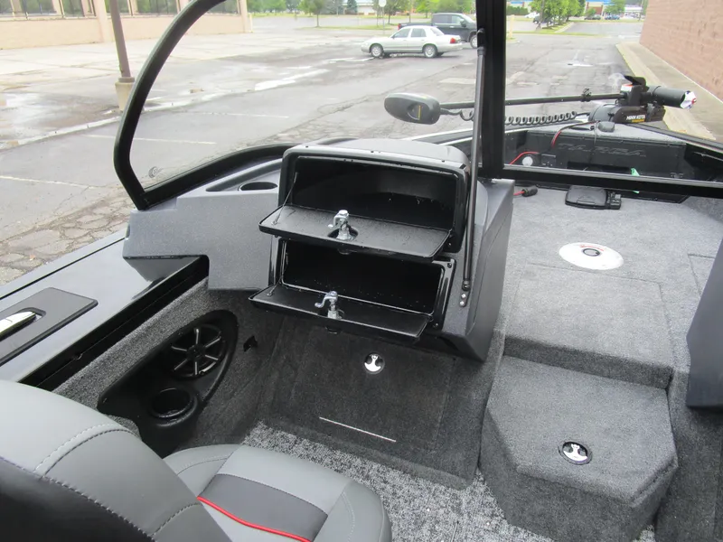 Slide: The Image of 2026 Tracker Targa 18 WT boat interior with storage compartments and seating. - 12