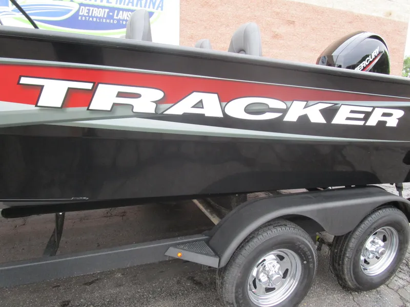 Slide: The Image of 2026 Tracker Targa 18 WT boat on trailer, featuring bold branding. - 4