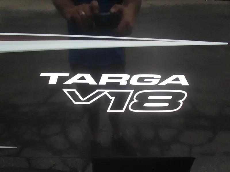 Slide: The Image of 2026 Tracker Targa 18 WT logo on a dark surface. - 5