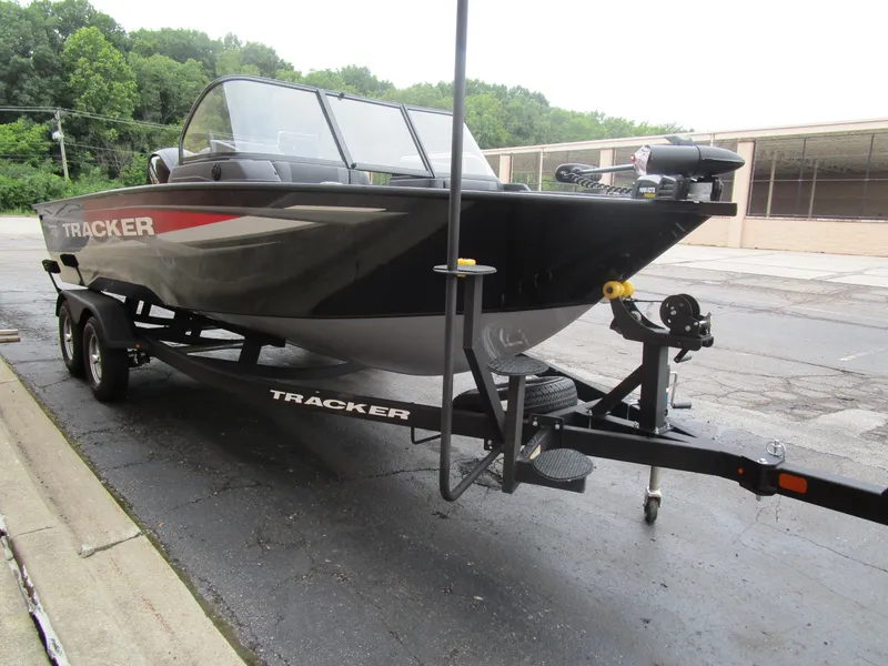 Slide: The Image of 2026 Tracker Targa 18 WT boat on trailer, parked outdoors. - 8