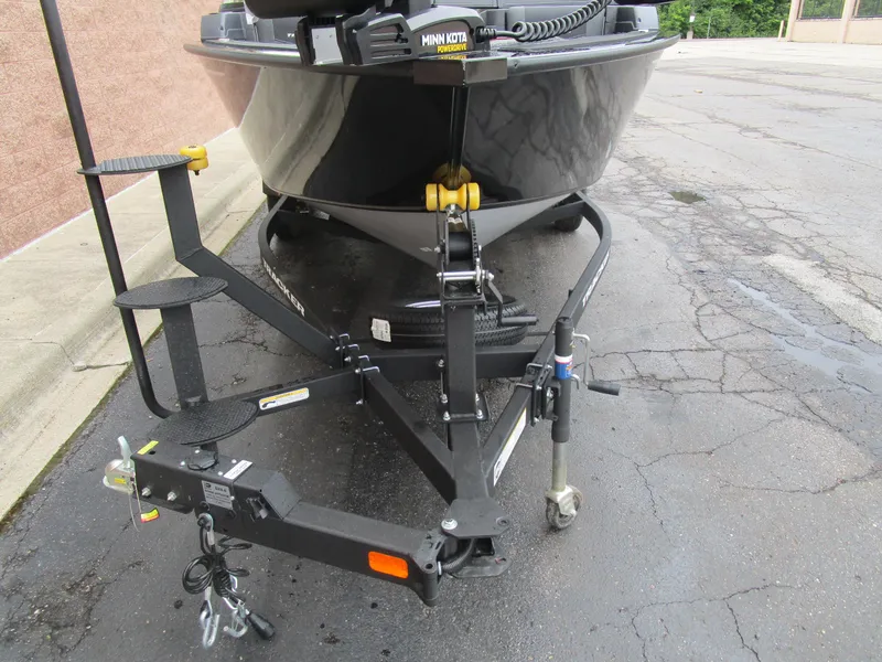 Slide: The Image of 2026 Tracker Targa 18 WT boat on trailer, featuring Minn Kota trolling motor. - 9