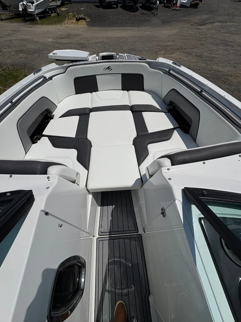 Slide: The Image of 2020 Monterey M65 boat interior with black and white seating arrangement. - 3