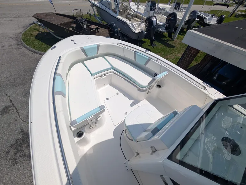 Slide: The Image of 2025 Robalo R250 Center Console boat with spacious seating and sleek design. - 11