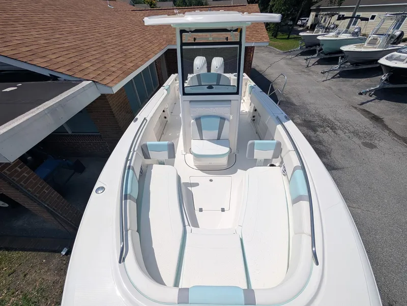 Slide: The Image of 2025 Robalo R250 Center Console boat with spacious seating and modern design. - 13