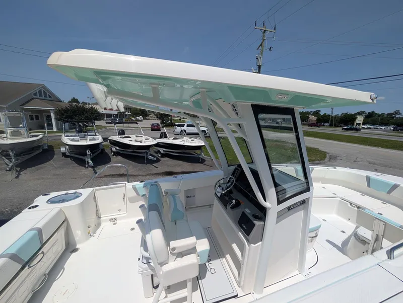 Slide: The Image of 2025 Robalo R250 Center Console boat with spacious deck and modern helm. - 8