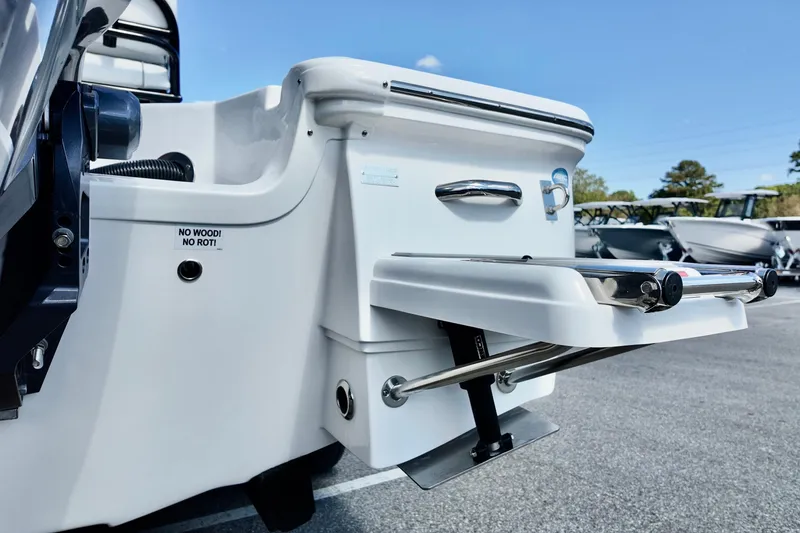 Slide: The Image of 2026 Sea Fox 231 Bay Fox boat with a foldable swim ladder and "No Wood! No Rot!" label. - 6