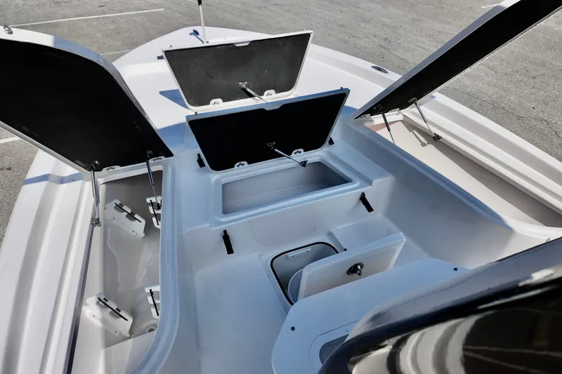 Slide: The Image of 2026 Sea Fox 231 Bay Fox boat storage compartments open, showcasing spacious interior design. - 8