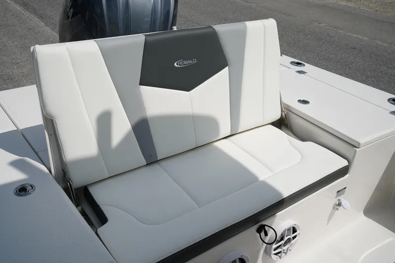 Slide: The Image of 2024 Robalo 226 Cayman boat seat with white and gray upholstery. - 15