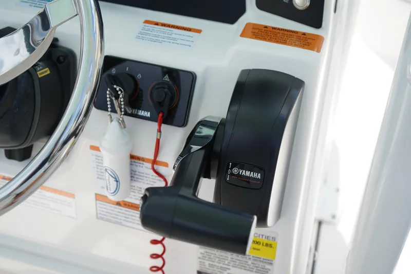Slide: The Image of 2024 Robalo 226 Cayman boat controls with Yamaha throttle and steering wheel. - 27