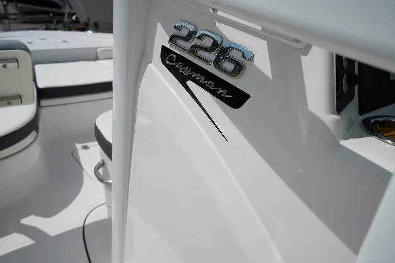 Slide: The Image of 2024 Robalo 226 Cayman boat interior with model emblem detail. - 33