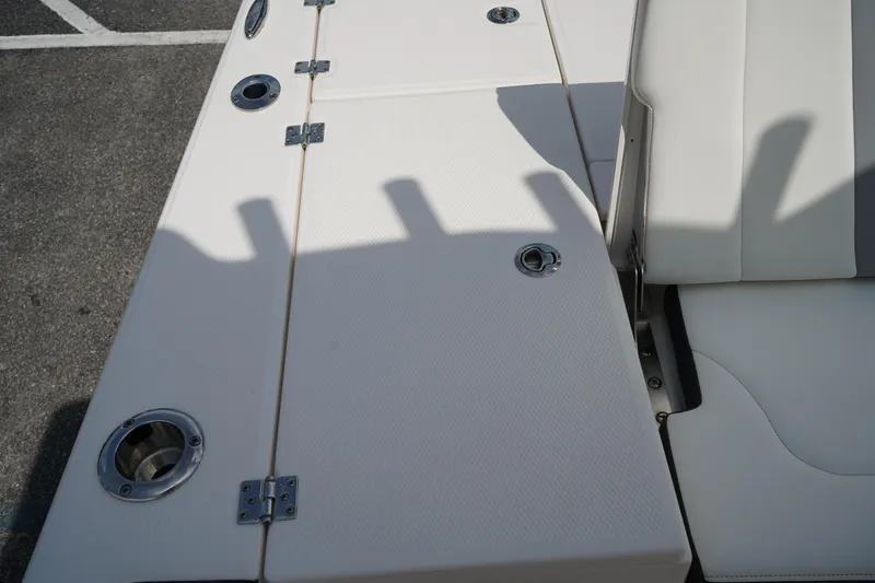 Slide: The Image of 2024 Robalo 226 Cayman boat deck with seating and cup holders. - 9