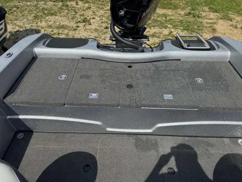 Slide: The Image of 2015 Nitro ZV 18 boat deck with motor and storage compartments. - 10
