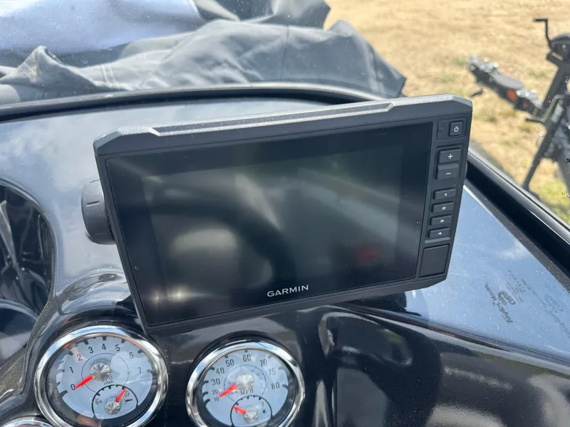 Slide: The Image of Garmin GPS device on 2015 Nitro ZV 18 boat dashboard with gauges. - 11