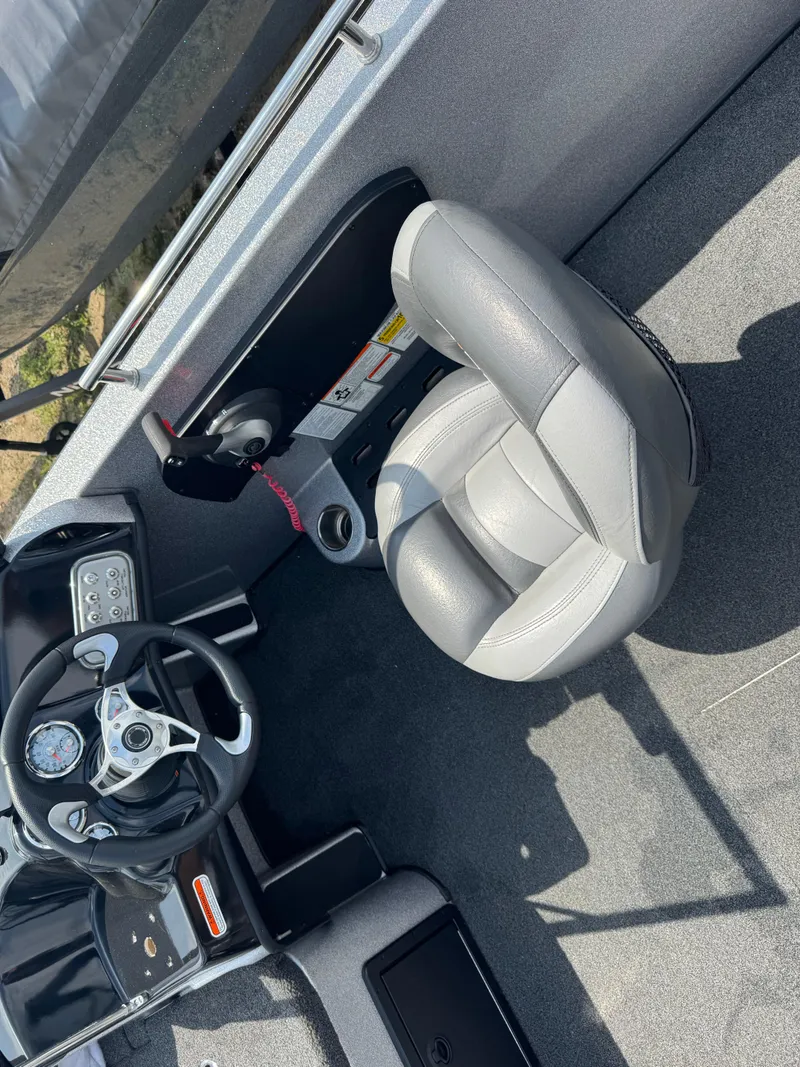 Slide: The Image of Interior of a 2015 Nitro ZV 18 boat showing steering wheel and seat. - 6