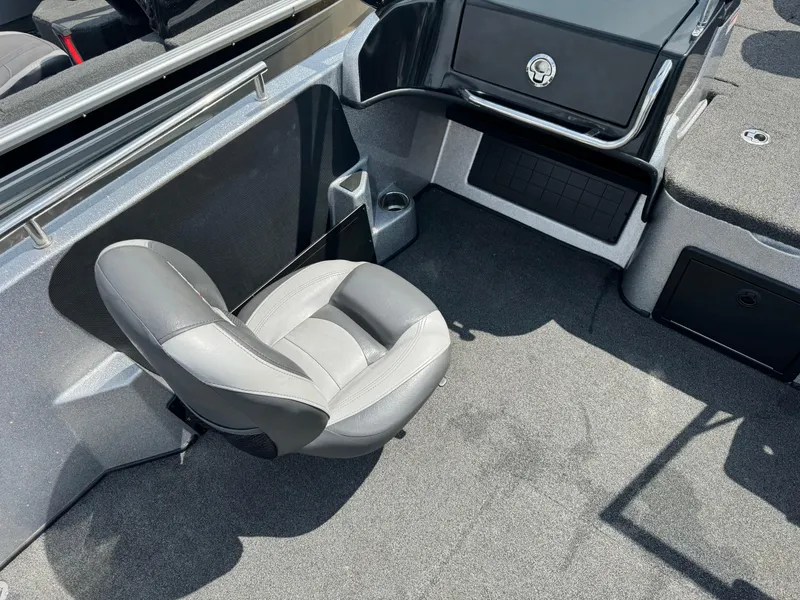 Slide: The Image of 2015 Nitro ZV 18 boat interior with gray seating and storage compartments. - 8