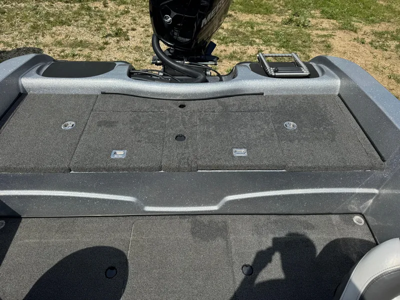 Slide: The Image of 2015 Nitro ZV 18 boat deck with motor and storage compartments. - 9
