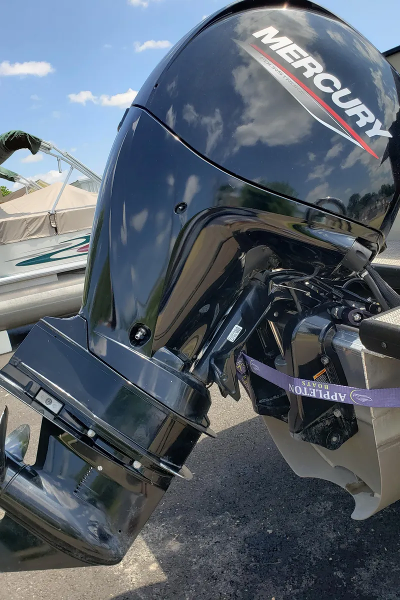 Slide: The Image of Outboard motor on a Viaggio 20F boat, 2022 model, under clear blue sky. - 12