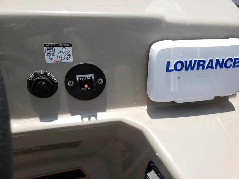 Slide: The Image of Control panel of 2022 Viaggio 20F boat with Lowrance device and switches. - 7