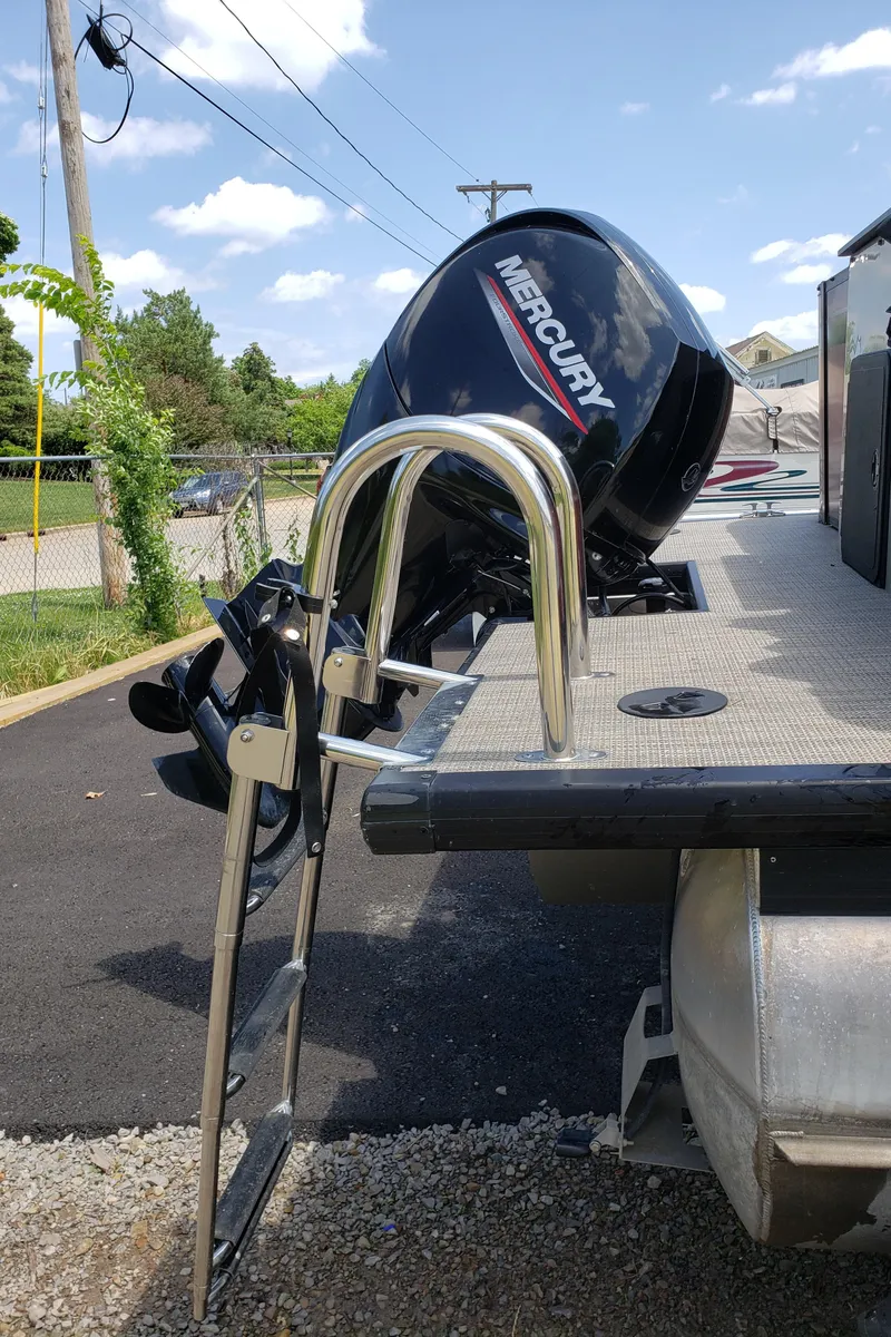 Slide: The Image of 2022 Viaggio 20F boat with Mercury outboard motor and ladder on a sunny day. - 9