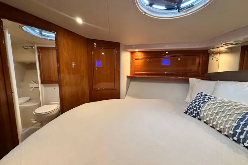 Slide: The Image of Luxurious 2005 Riviera 47 Open Flybridge yacht bedroom with ensuite bathroom. - 112