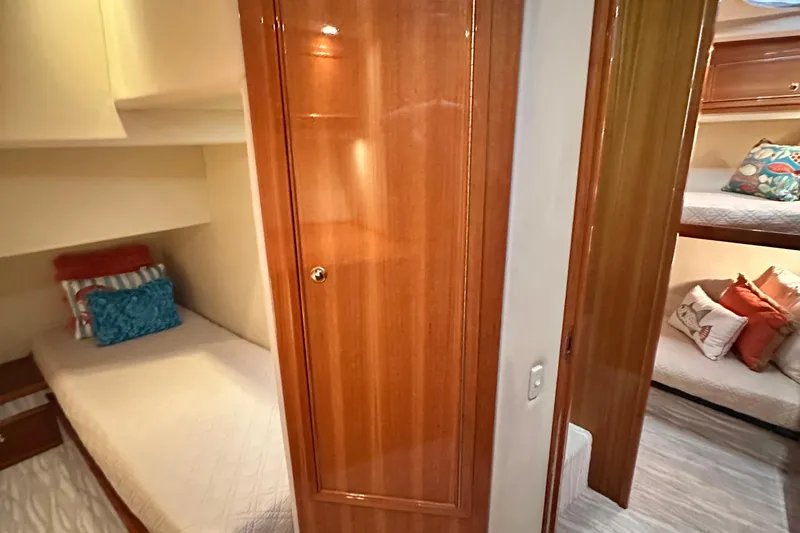 Slide: The Image of Interior of 2005 Riviera 47 Open Flybridge with cozy cabin and wooden finishes. - 133