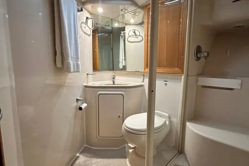 Slide: The Image of Luxurious bathroom in 2005 Riviera 47 Open Flybridge yacht, featuring modern fixtures and elegant design. - 147
